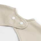 Bavoirs à manches avec poche - Lalee sable P'tits Loups Shop